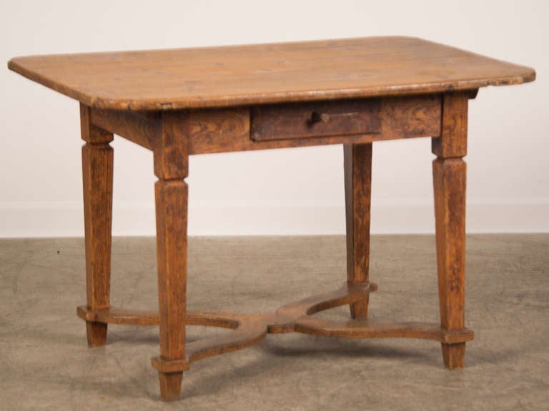 Receive our new selections direct from 1stdibs by email each week. Please click Follow Dealer below and see them first!

An antique French Baroque style pine table with the original painted finish standing on straight tapered legs joined by an