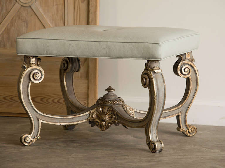 Baroque Style Carved Bench, Italy c.1890, Silver Gilt, Painted Finish. The exuberant profile of this bench reflects the fantastic quality known as Baroque with its exaggerated curved legs that sweep inward to join at the centre in a raised centre