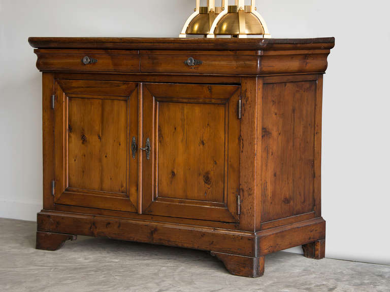 Louis Philippe Pine Buffet, France c.1865. The rich colour and lustrous patina seen on this buffet add to its handsome appearance. Constructed to provide generous storage with a pair of drawers mounted above a pair of cabinet doors this cabinet