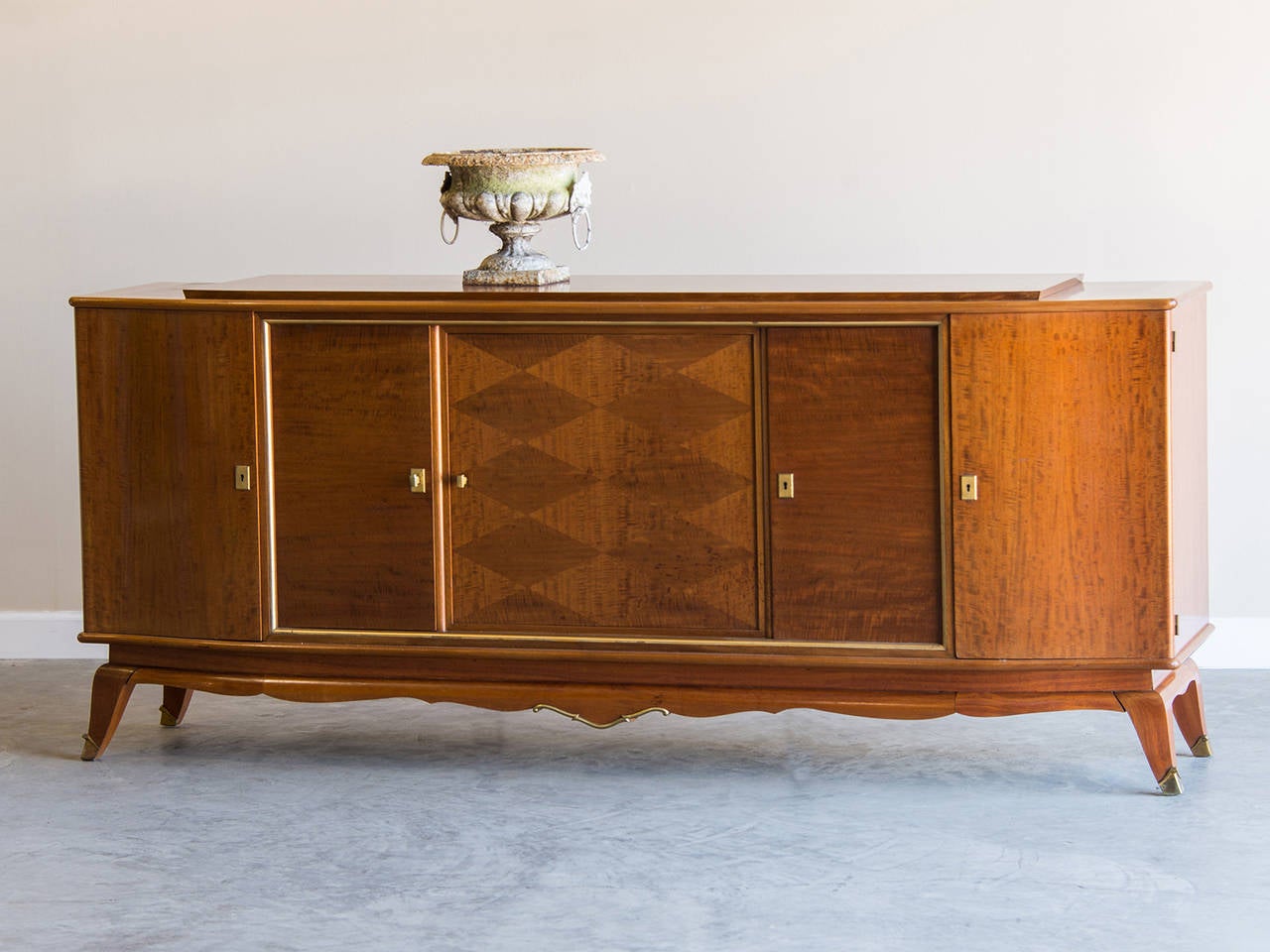 Receive our new selections direct from 1stdibs by email each week. Please click Follow Dealer below and see them first!

The highly decorative appearance of this vintage French buffet circa 1940 with its use of figured timber, harlequin pattern