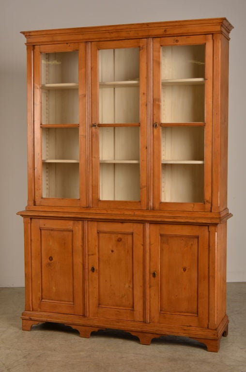 Receive our new selections direct from 1stdibs by email each week. Please click Follow Dealer below and see them first!

A handsome George III style pine bookcase or display cabinet of large scale from England, circa 1860. Please note the