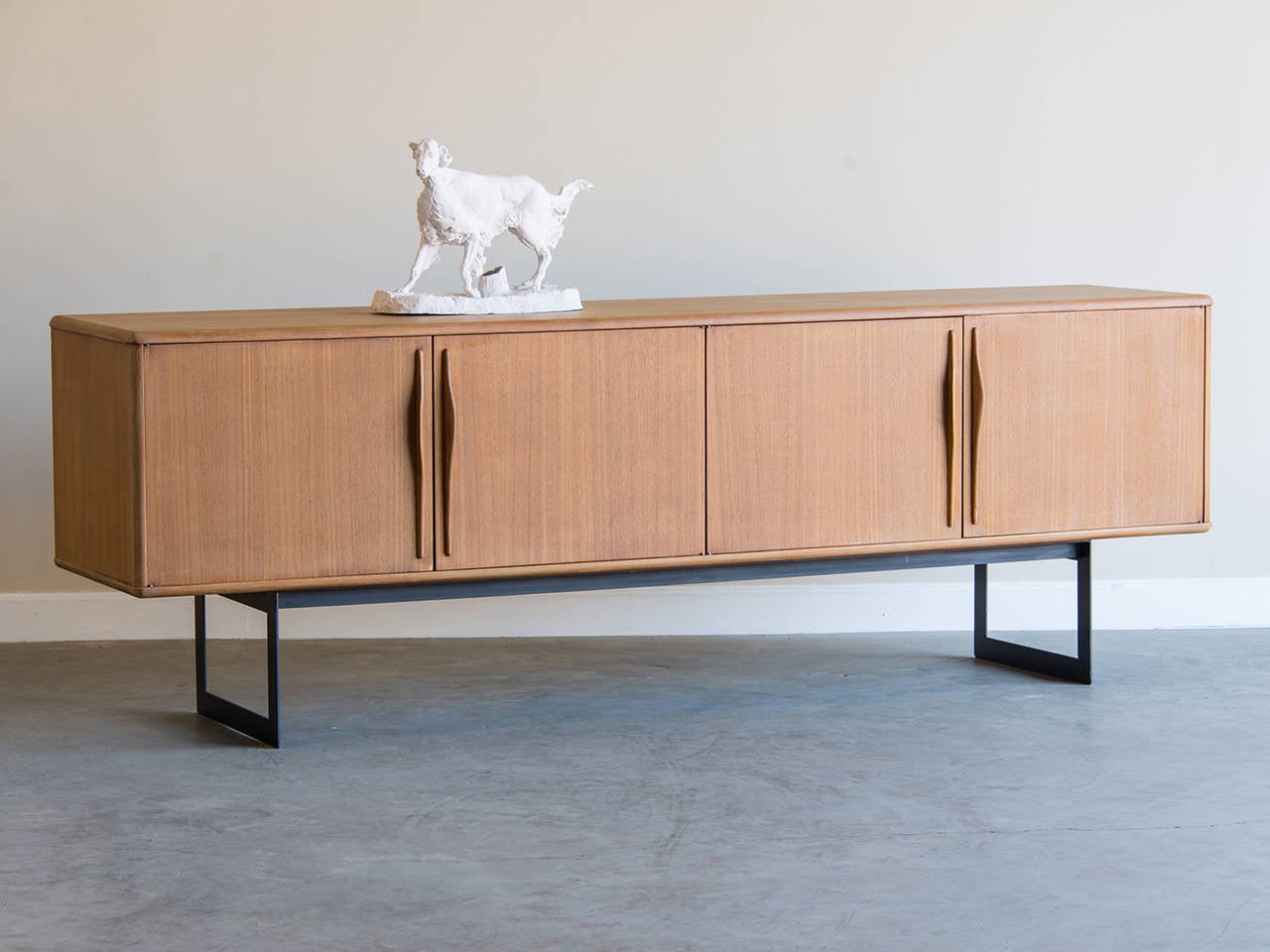 Vintage pale mahogany buffet, Mid-Century France, circa 1960. The marvelous colour of this Danish design buffet is the result of removing the old stained finish for a fresh appearance. The elegant restraint in the design with four cabinet doors that