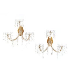 A pair of three arm sconces in the Marie-Therese style