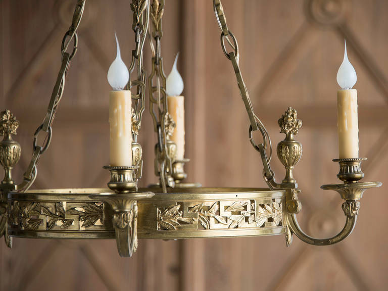 20th Century Antique French Neoclassical Gilt Bronze Four Arm Chandelier, circa 1920
