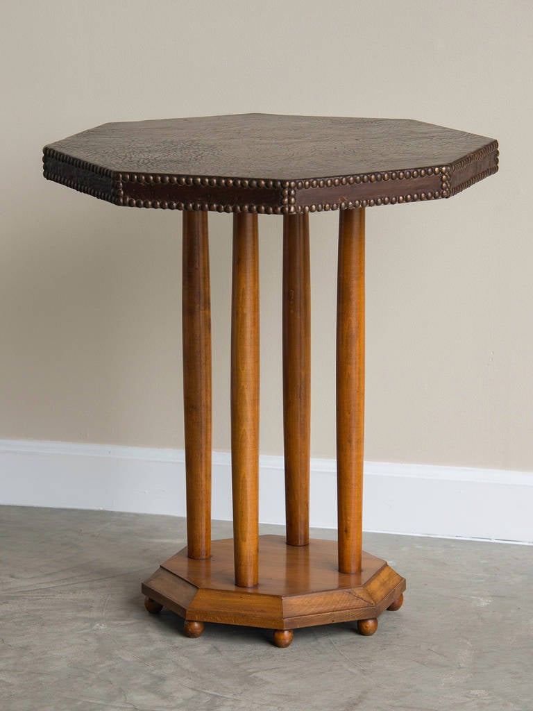 Receive our new selections direct from 1stdibs by email each week. Please click “Follow Dealer” button below and see them first!

The handsome octagonal top of this table has been sheathed in leather secured with a pattern of nail heads that give