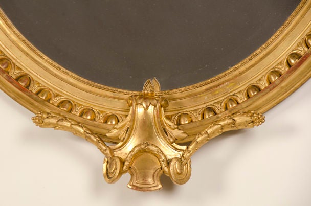 Beveled Lavish Antique French Louis XVI Style Oval Gold Leaf Mirror, circa 1880
