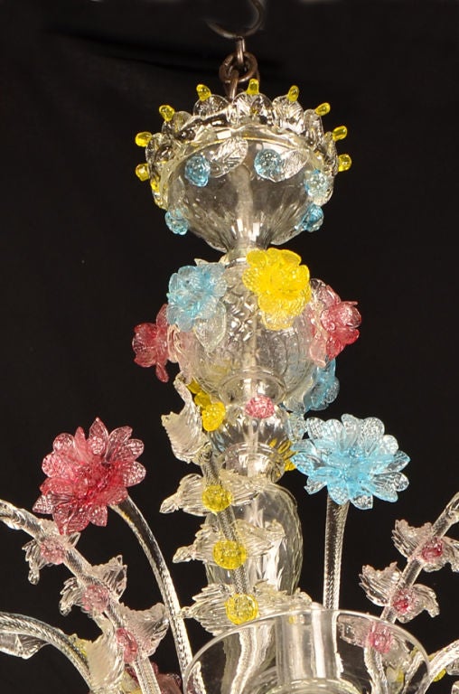 A beautiful hand blown glass chandelier from the island of Murano near Venice, Italy c.1920. Please notice the incomparable ability of the artisans who created this functional piece of lighting using the most impractical material of all, namely hand