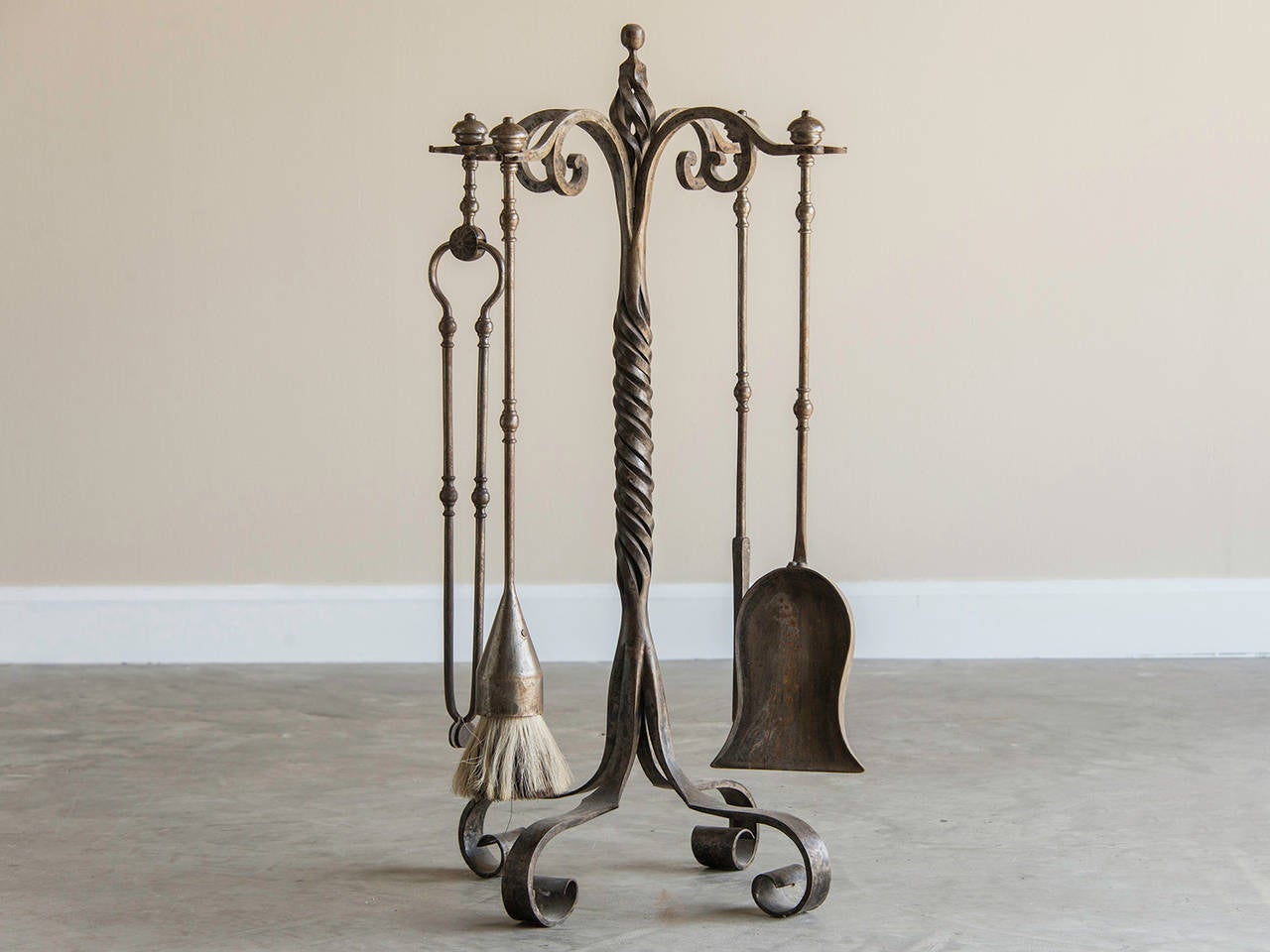 Receive our new selections direct from 1stdibs by email each week. Please click “Follow Dealer” button below and see them first!

This impressive Vintage set of fireplace accessories circa 1920 features four essential tools for tending a fire in an