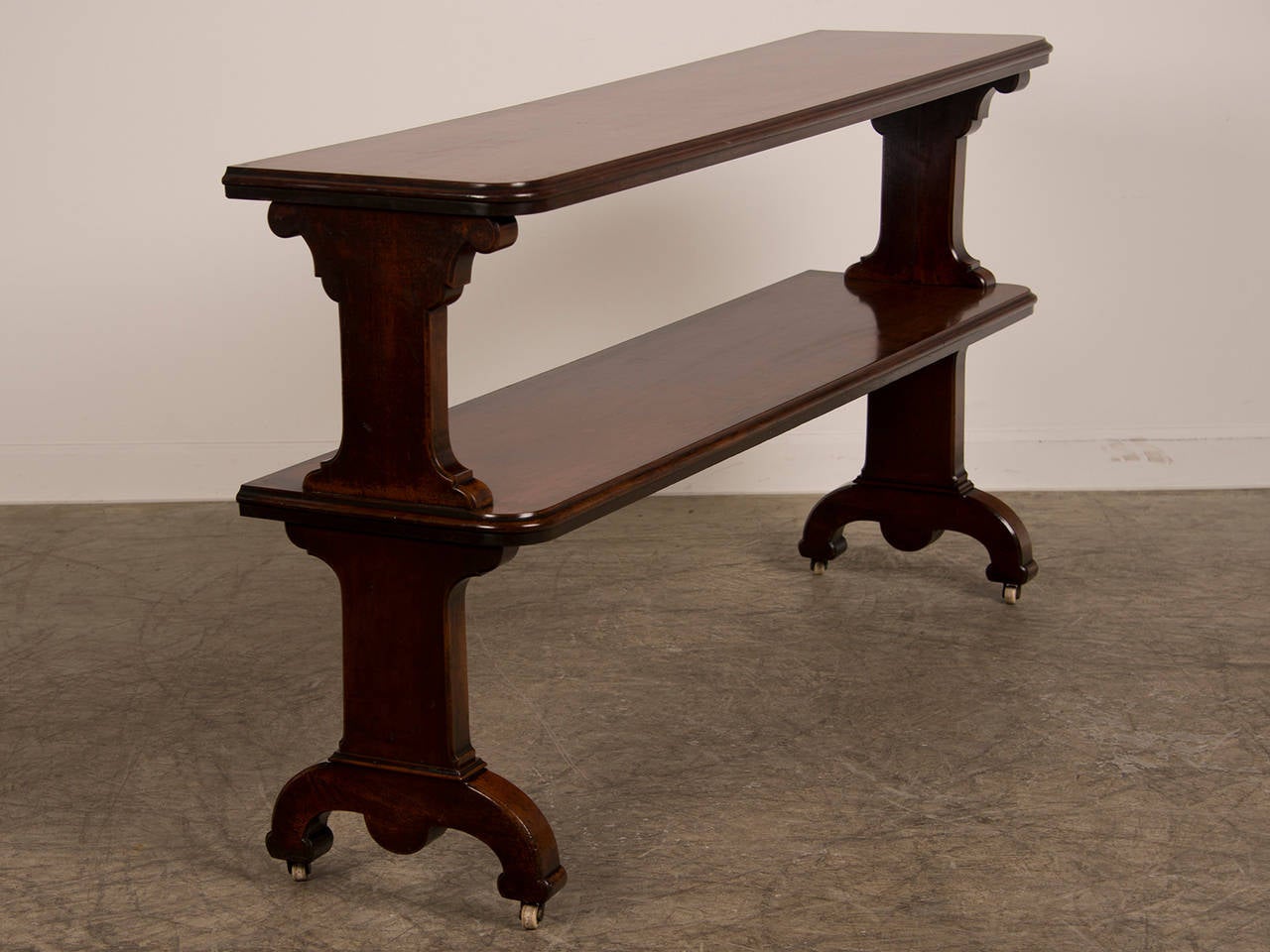 Receive our new selections direct from 1stdibs by email each week. Please click on “Follow Dealer” button below and see them first!

Antique Irish mahogany two shelf server, original casters, circa 1870. The bold scale and solid material on this