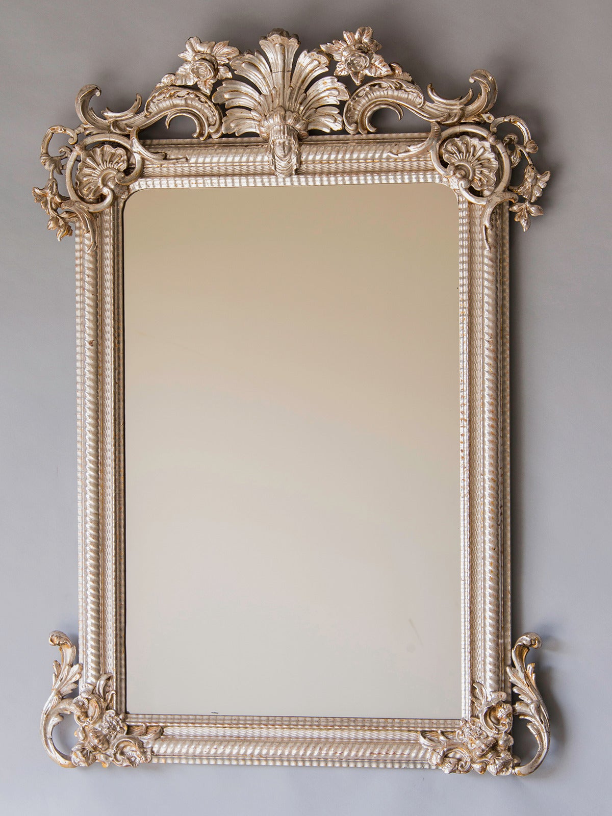 Régence Style Silvered Mirror, France c.1880. The wonderfully exuberant design of this mirror reflects (no pun intended) both the symmetry and grandeur of Louis XIV as well as presaging the whimsicality of the rococo seen after Louis XV became King