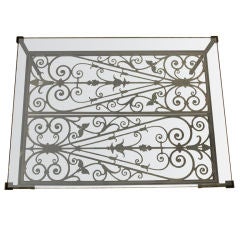 A coffee table created from forged iron grates France c.1890