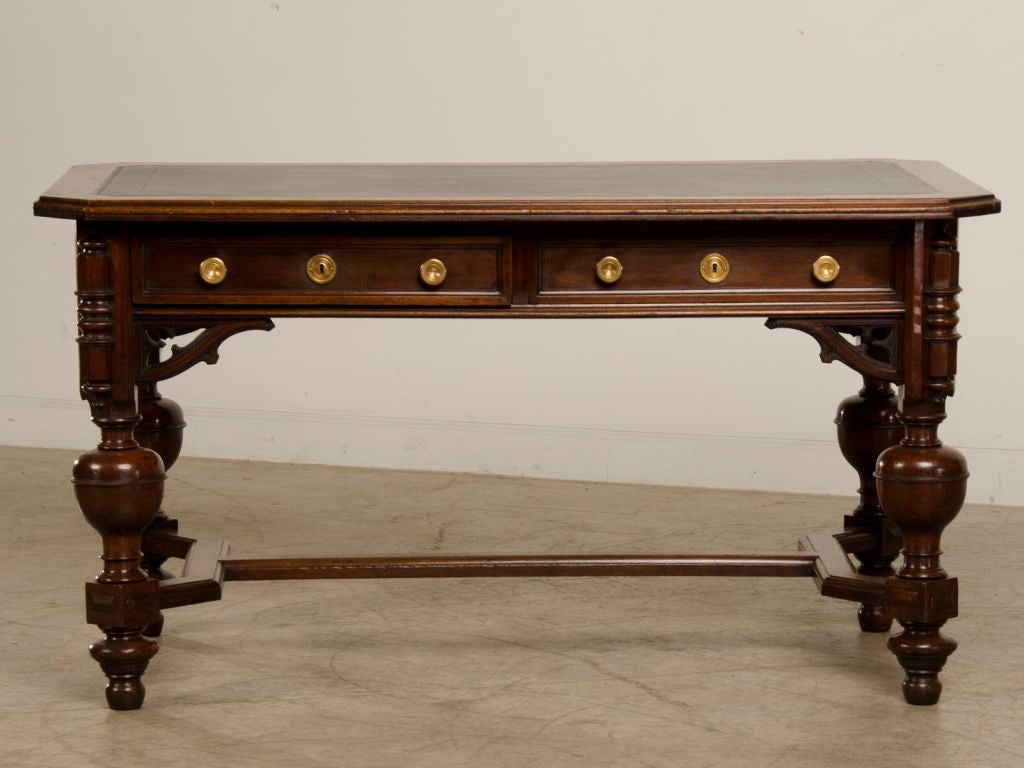 A Gothic Revival style walnut writing table from England c.1875