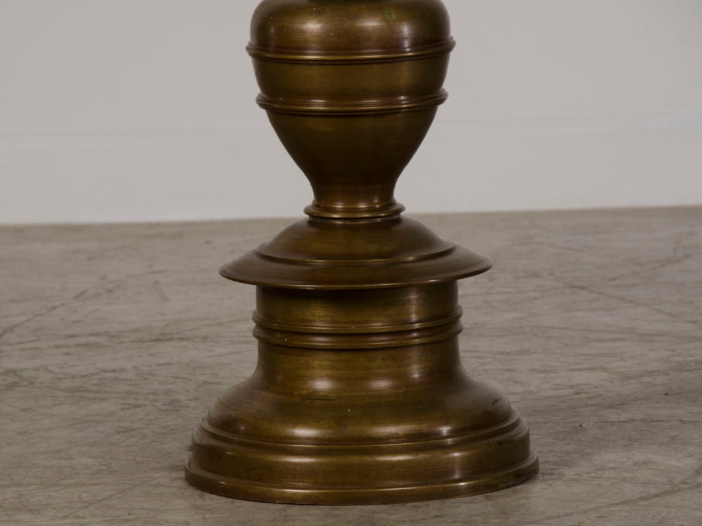 A pair of striking solid bronze candle stands from Italy c.1880 1