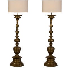 A pair of striking solid bronze candle stands from Italy c.1880