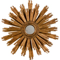 A Louis XIV style gilded sun burst mirror from France c.1890