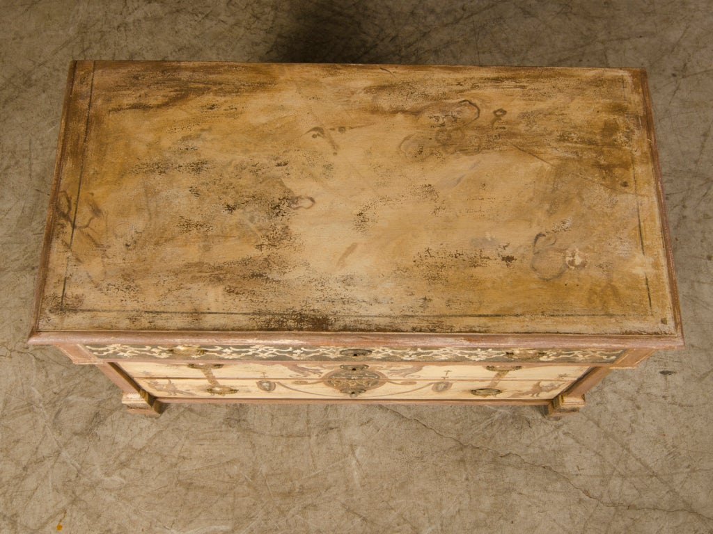 A handsome Biedermeier period chest of drawers from Germany c.1820. This handsome painted chest has traces of the original painted decoration that remained that have now been refreshed and brightened. All antique painted pieces were originally