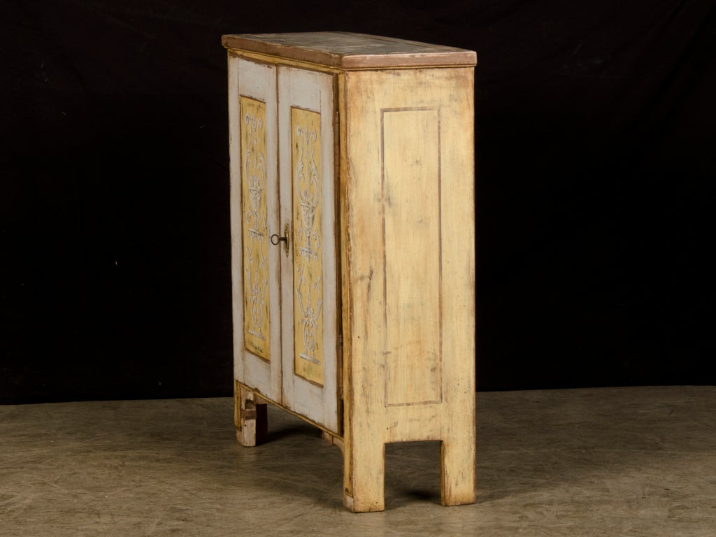 A shallow two door low painted cabinet from Germany c.1825 1