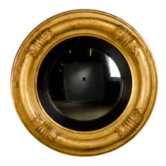 Antique A bold Regency style gilded convex mirror from England c.1850