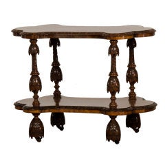 Antique A marvelously carved burl walnut tier table from England c.1865