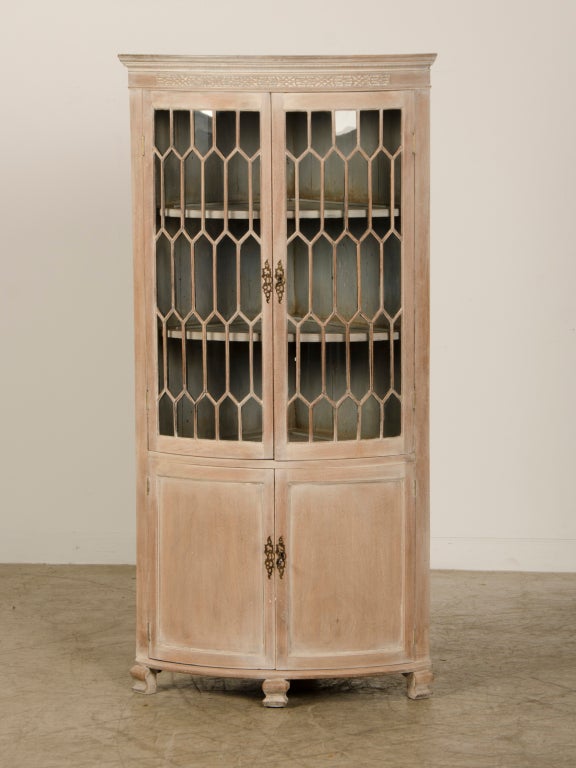 A pair of Georgian style corner cabinets from England c.1890