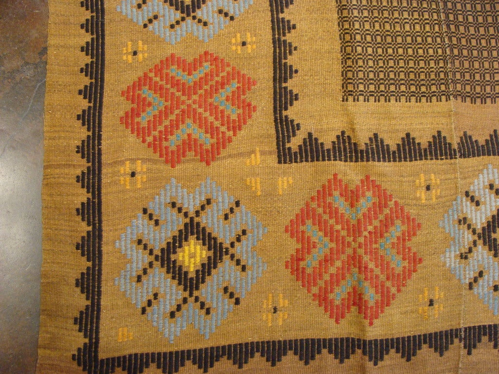 A beautifully woven antique kilim from the 1st quarter of the 20th century. The pattern of this carpet was rendered using an appliqué  technique, creating a lovely texture and crispness of design. This work was woven on a small nomadic-style loom