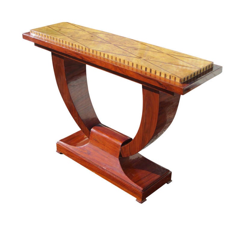 Table features an attractive,maple, burl top with diamond pattern, wood inlay attached to two curvilinear supports.