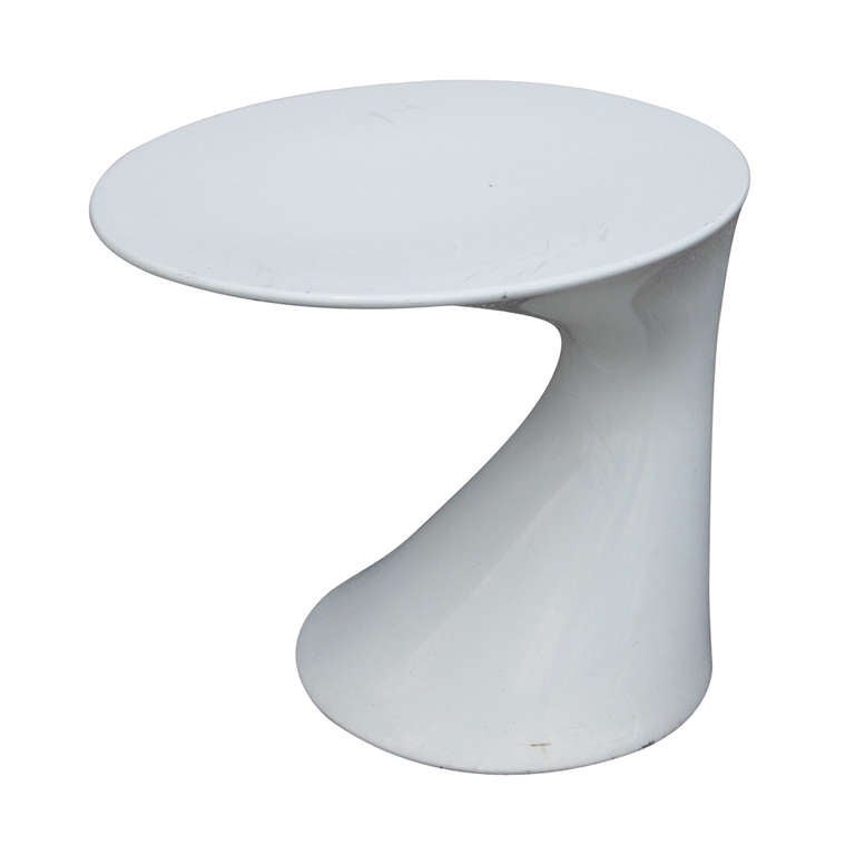 The Tod Table designed by Todd Bracher in 2005.

Able to fit almost anywhere, the single piece construction, streamlined
polypropylene frame and glossy lacquered finish gives the Tod Table a sleek, contemporary look for both indoors or