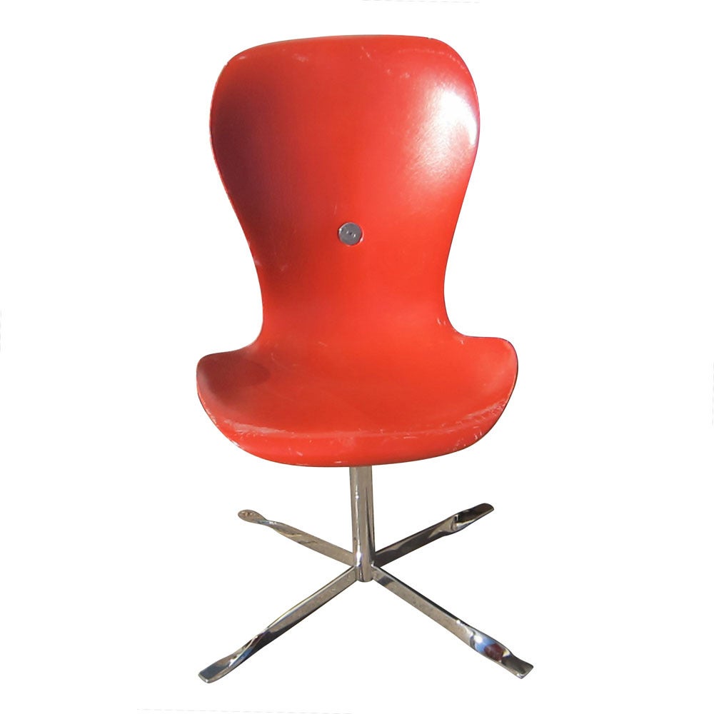 A fiberglass shell is held onto a chromed steel base with rubber shock mounts for maximum comfort. This revolutionary design in ergonomic seating was created for the 1962 Worlds Fair in Seattle.