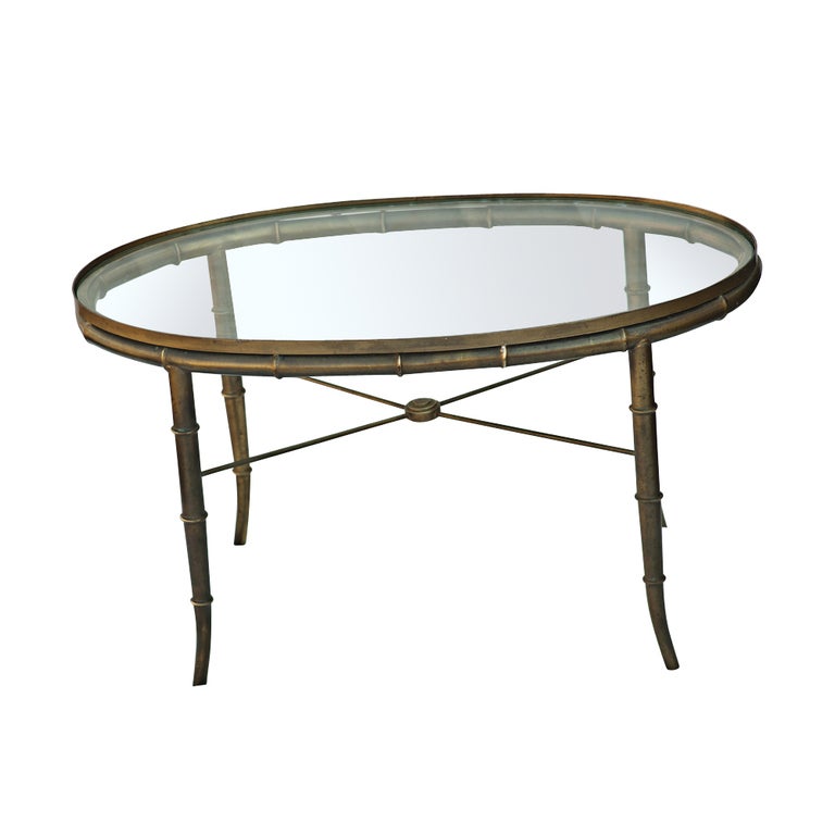 Mastercraft Brass Bamboo Oval Cocktail Table made in the 1960s 

A classical style bamboo frame with an inset glass top.