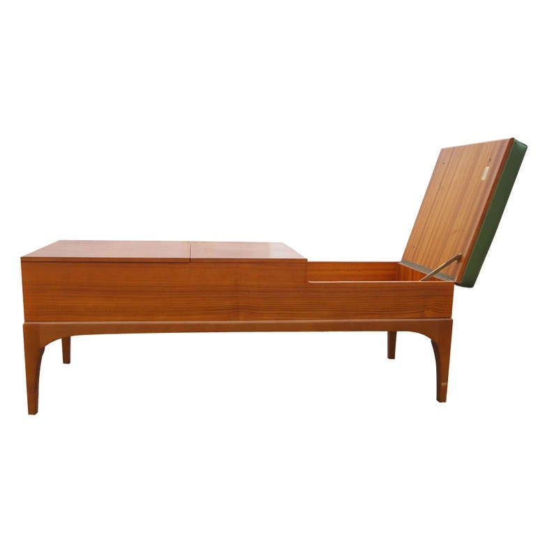 Clean-lined, vintage compartment bench by Nathan. 

A British modern vintage design bench with two compartments and one soft cushion. Functional and sleek design. Solid teak wood.