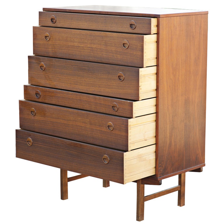 A beautiful mid century modern Scandinavian style six drawer dresser or chest made by DUX.  Teak with recessed sculptural circular drawer pulls.