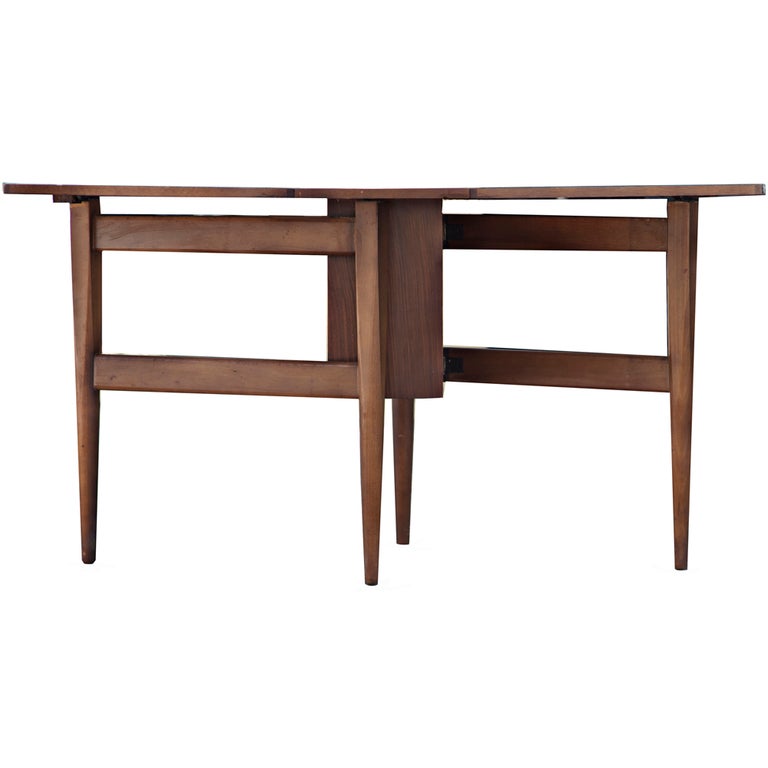 A stunning scandinavian table with a sculptural gateleg base. 
The table is superbly constructed and features slim tapered legs.  A great addition for compact spaces.  Similar examples of Scandinavian gateleg dining tables have been attributed to