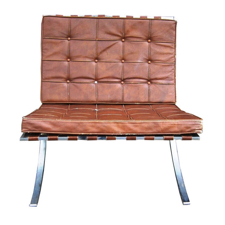 A pair of Mid Century Modern Barcelona chairs. 

Seat and back cushions adapt to fit the curve of the frame. Frame is welded in single-piece construction from a single stainless steel block for ultimate durability. The base is hand-buffed to a