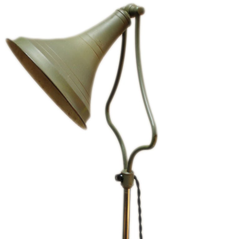A metal floor lamp from the Industrial Age made by Will Ross with a pivoting shade and adjustable height from 50