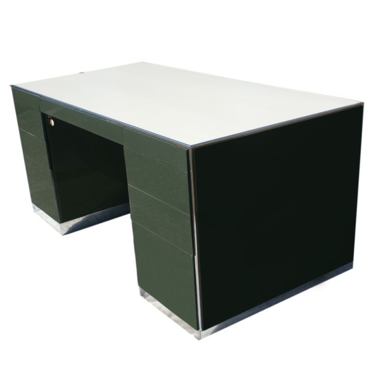 A mid cneutry modern desk and credenza designed by Davis Allen and made by GF.  Green metal with chrome bases and accents and white tops.  The credenza measures 23