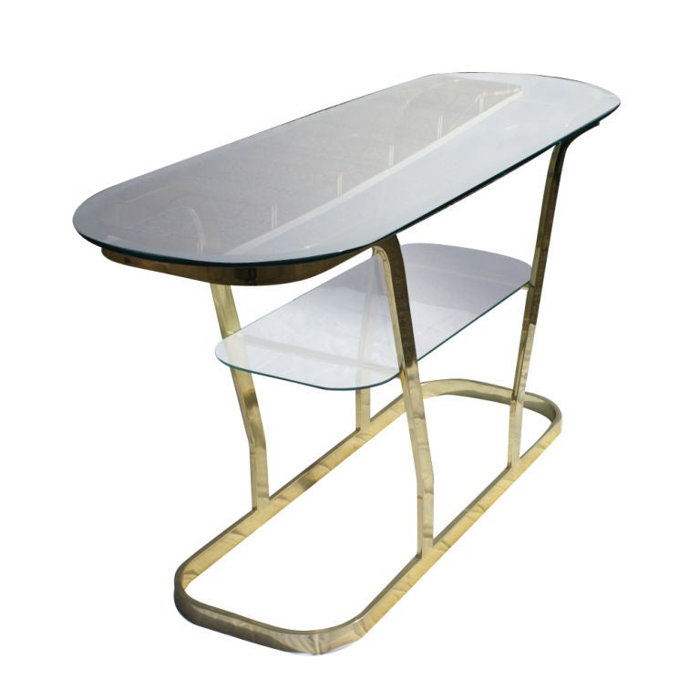 A mid century modern brass and glass two-tier table which could be used as a sofa table or console table.