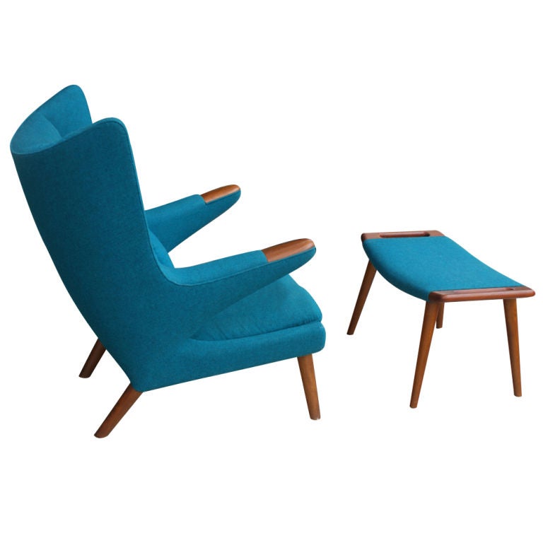 A mid century modern classic Papa Bear chair designed by Hans Wegner.  Teak with original blue fabric upholstery.