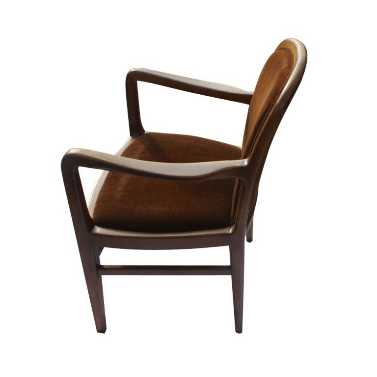 A pair of chairs designed by Jack Lenor Larsen.  Walnut frames with rich mohair upholstery.