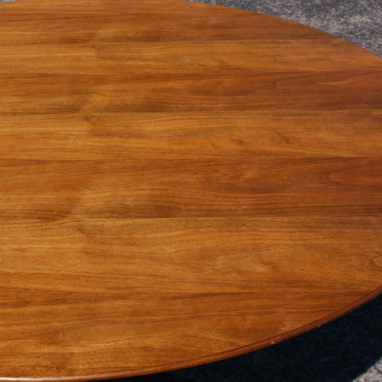 A mid century modern round dining table designed by Eero Saarinen and made by Knoll.  A 48