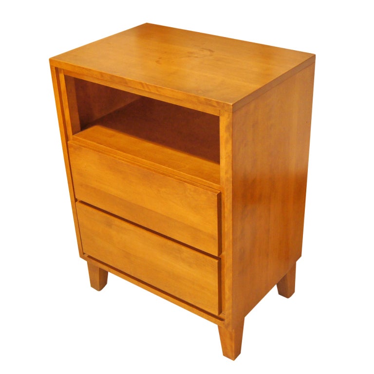 A mid century modern nightstand designed by Russel Wright and made by Conant Ball.