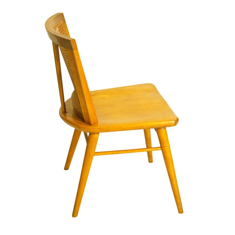 A pair of mid century modern side or dining chairs designed by Russel Wright and made by Conant Ball.
