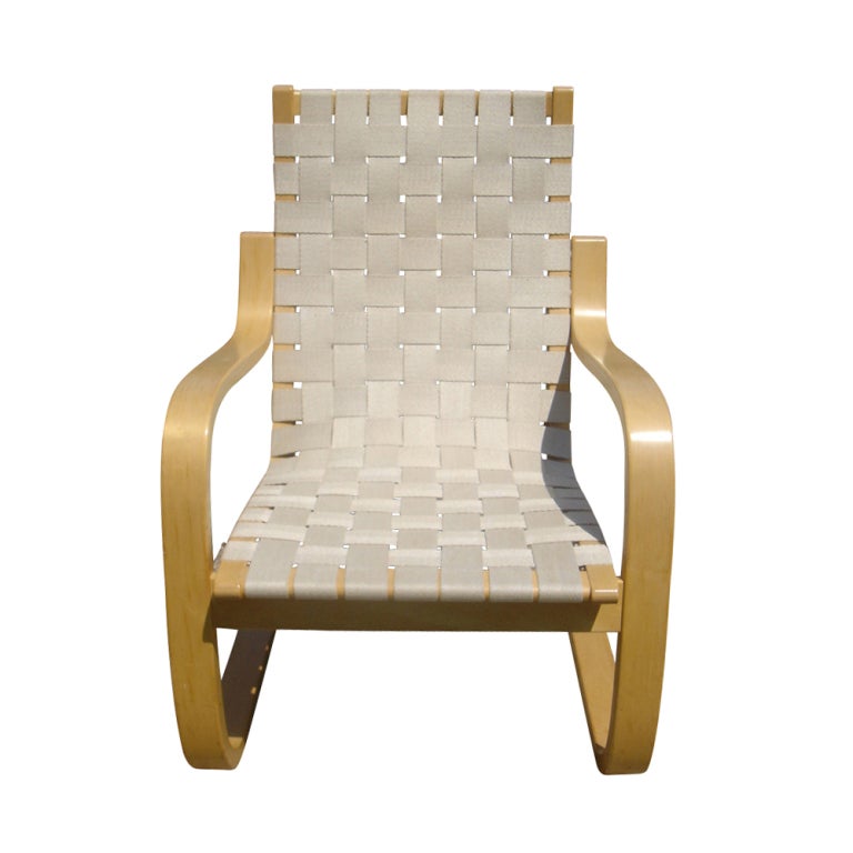 A pair of mid century modern lounge chairs Model 406 designed by Alvar Aalto and made by Artek.  Birch frames with woven linen webbing.