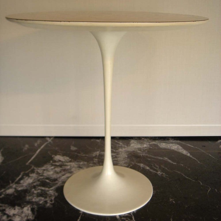 A pair of mid century modern side tables designed by Eero Saarinen and made by Knoll.  White tulip aluminum bases with white laminate tops.  These examples are from the early 1960's.