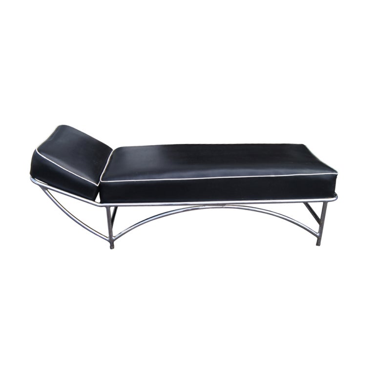An Art Deco or Art Moderne daybed designed by KEM Weber and made by Lloyd Loom.  A tubular chrome frame with black vinyl upholstery with white welting.