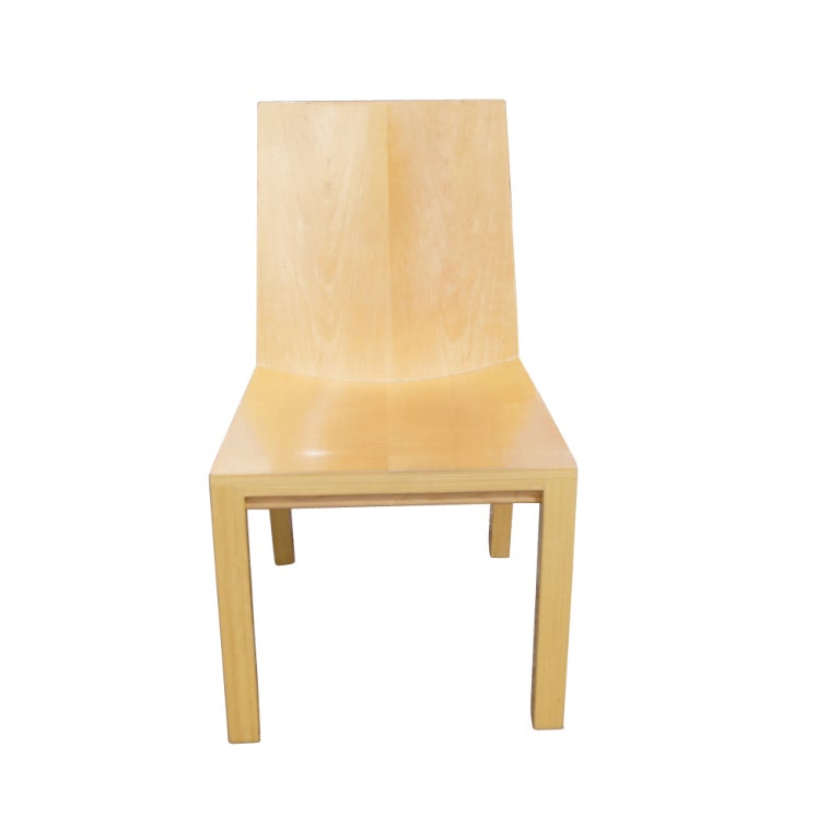  Library chairs designed and made by Dakota Jackson.  A classic, straightforward design in natural Cordovan maple.