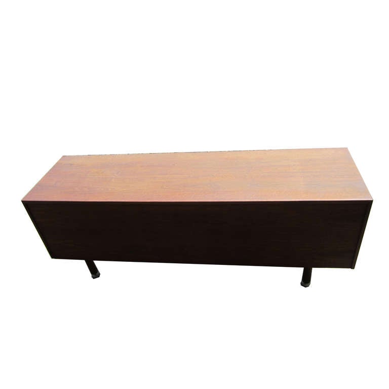 A rare and unique vintage Jens Risom credenza, this particular piece has y-shaped metal pulls, six regular drawers, one partitioned drawer, a filing drawer and a shelved cabinet. An extremely versatile and space-efficient credenza, this quality work