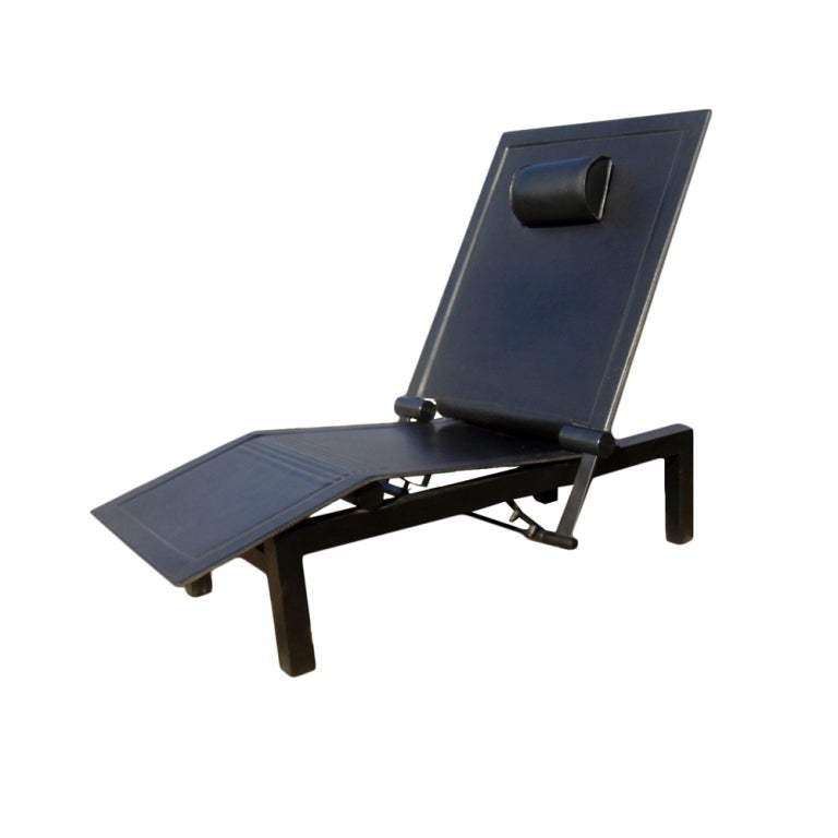 A postmodern Consoni chaise longue from the Memphis school made in Italy and sold by Domus.  A black resin frame with black leather seat, back, and neck rest.  The back adjusts to three different angles.