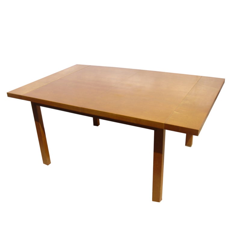 A mid century modern extension dining table designed by Hendrik Van Keppel and Taylor Green and made by Brown Saltman.  The base made of tanquile mahogany.  The top of tanquile mahogany with Hawaiian koa wood end panels.  The table expands from 64”