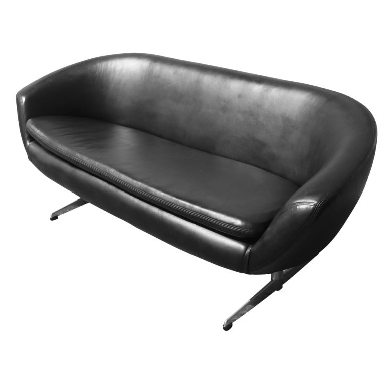 A mid century modern sofa made by Overman in Sweden.  Sculptural lines newly upholstered in black leather.  As shown in the last image, we also have a matching lounge chair listed on 1stdibs.