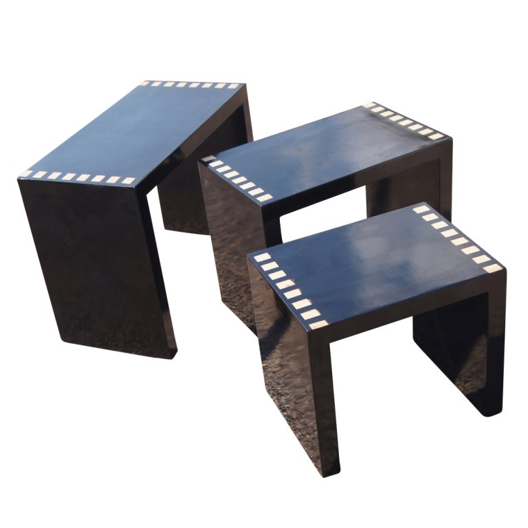 A set of three black lacquer contemporary style nesting tables.  They measure: Large- 23